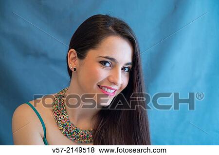 Portrait of young woman smiling and looking at the camera. Close view. View Large Photo Image Stock Photo - Portrait of young woman smiling and looking at the camera. Close view.. Fotosearch