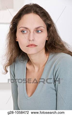 portrait of young woman thoughtful and observing something View Large Photo Image Stock Image - portrait of young woman thoughtful and observing something. Fotosearch
