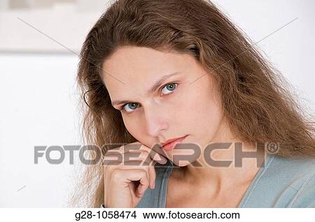 portrait of young woman thoughtful View Large Photo Image Picture - portrait of young woman thoughtful. Fotosearch