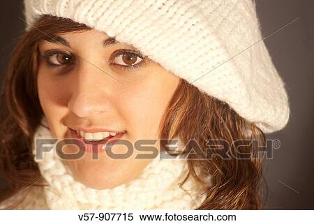 Portrait of young woman wearing knitted beret and scarf. Close view. View Large Photo Image Stock Photography - Portrait of young woman wearing knitted beret and scarf. Close view.. Fotosearch