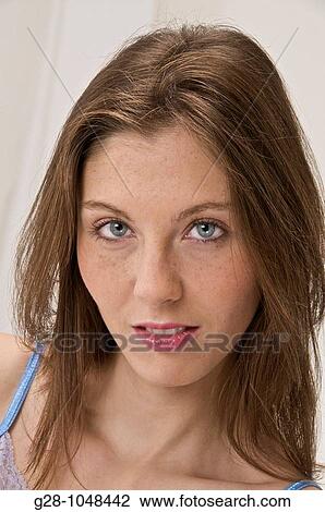 portrait of young woman with blue eyes and long hair smiling View Large Photo Image Stock Image - portrait of young woman with blue eyes and long hair smiling. Fotosearch
