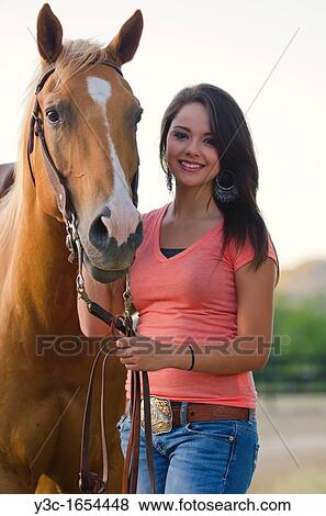 Portrait of young woman with horse View Large Photo Image Stock Photo - Portrait of young woman with horse. Fotosearch