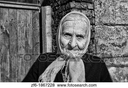 Portrait older woman in front of house in small village in Poznan Poland View Large Photo Image Stock Photo - Portrait older woman in front of house in small village in Poznan Poland. Fotosearch