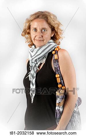 Portrayed lady with scarf and bag on study View Large Photo Image Stock Photo - Portrayed lady with scarf and bag on study. Fotosearch