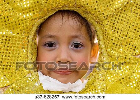 Portraying a sunflower kid during Kuching City Day parade. Kuching, Sarawak, Malaysia View Large Photo Image Stock Photo - Portraying a sunflower kid during Kuching City Day parade. Kuching, Sarawak, Malaysia. Fotosearch