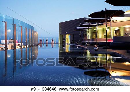 Portugal, Madeira, Funchal, Hotel design The Vine, architect Ricardo Boffil from Spainl, designer Nini Andrade from New York and Madeira, opened in 2010, the roof terrace and swimming pool View Large Photo Image Stock Photograph - Portugal, Madeira, Funchal, Hotel design The Vine, architect Ricardo Boffil from Spainl, designer Nini Andrade from New York and Madeira, opened in 2010, the roof terrace and swimming pool. Fotosearch