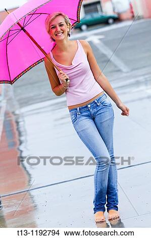 Posing on a parking place with bare feet young woman View Large Photo Image Picture - Posing on a parking place with bare feet young woman. Fotosearch