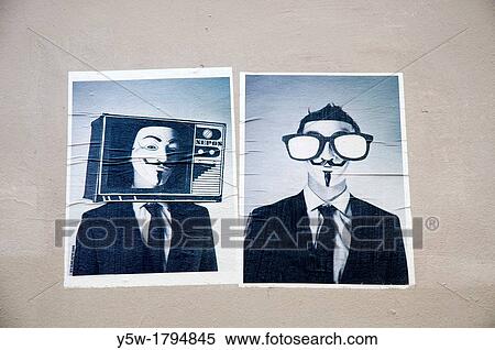 Stock Photography - Posters fixed to a wall in Montmartre, Paris. Fotosearch