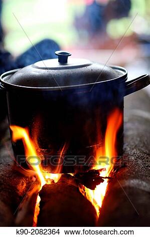 Pot on the open fire, cooking water, Papua, Indonesia, Southeast Asia. View Large Photo Image Picture - Pot on the open fire, cooking water, Papua, Indonesia, Southeast Asia.. Fotosearch