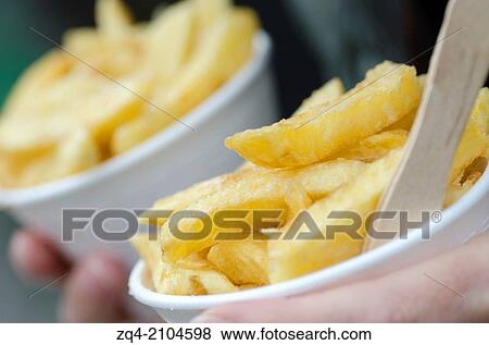 Potato Chips in paper cones. Takeaway from chip shop. View Large Photo Image Stock Photo - Potato Chips in paper cones. Takeaway from chip shop.. Fotosearch