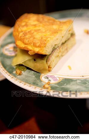 Potato omelette, cheese and green peppers. Pintxos, San Sebastian (Donostia), Basque Country, Spain View Large Photo Image Picture - Potato omelette, cheese and green peppers. Pintxos, San Sebastian (Donostia), Basque Country, Spain. Fotosearch