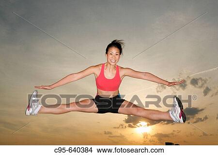 Potomac river, Washington, DC, USA, woman jogging and jumping, 23 years old. View Large Photo Image Picture - Potomac river, Washington, DC, USA, woman jogging and jumping, 23 years old.. Fotosearch