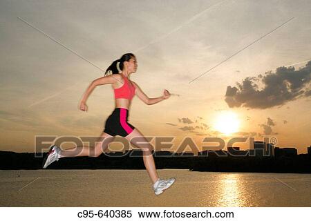 Potomac river, Washington, DC, USA, woman jogging and jumping, 23 years old, Asian. View Large Photo Image Stock Photography - Potomac river, Washington, DC, USA, woman jogging and jumping, 23 years old, Asian.. Fotosearch