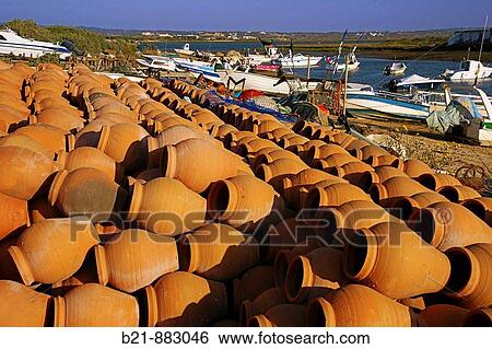 Stock Photograph - Pottery for octopus fishing at Isla Canela, Ayamonte, Huelva province, Andalusia, Spain. Fotosearch