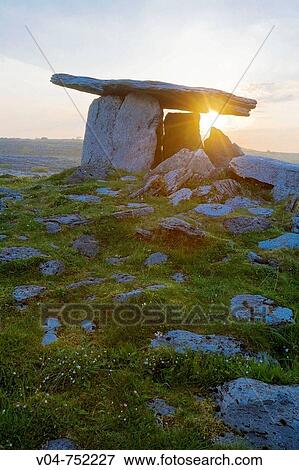 Poulnabrone Megalithic Tomb with rising sun in the Burren, Ireland, Europe View Large Photo Image Stock Photo - Poulnabrone Megalithic Tomb with rising sun in the Burren, Ireland, Europe. Fotosearch