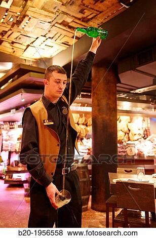 Pouring cider, Restaurant Sidrer? a Tierra Astur, Gij? n, Asturias, Spain. View Large Photo Image Stock Photo - Pouring cider, Restaurant Sidrer? a Tierra Astur, Gij? n, Asturias, Spain.. Fotosearch