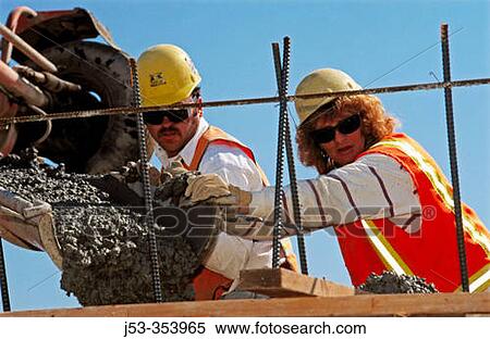 Stock Photography - Pouring concrete (female worker). I-880 Cypress project. Oakland, California. USA.. Fotosearch