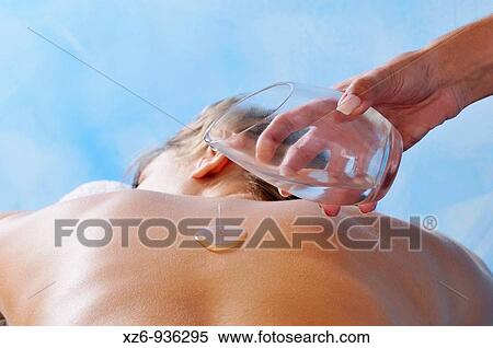 Pouring essential oil on the back in the SPA View Large Photo Image Stock Photography - Pouring essential oil on the back in the SPA. Fotosearch