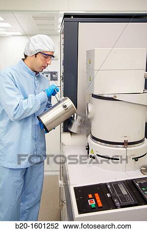 Pouring liquid nitrogen to improve the vacuum in the chamber to deposit thin films View Large Photo Image Stock Image - Pouring liquid nitrogen to improve the vacuum in the chamber to deposit thin films. Fotosearch