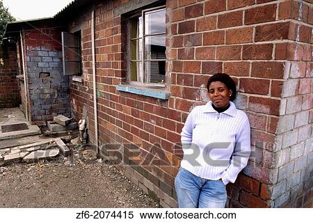 Stock Photography - Poverty Stricken Woman in South African Shanty Town.. Fotosearch