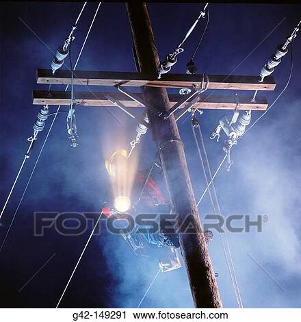 Stock Image - Power company lineman. Fotosearch