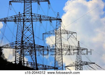 Power lines against blue sky with clouds. View Large Photo Image Stock Image - Power lines against blue sky with clouds.. Fotosearch
