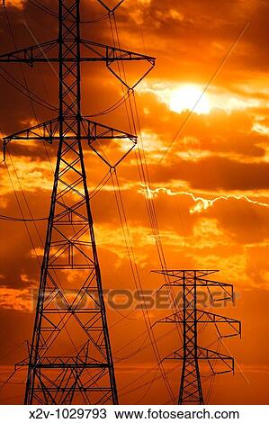 Power lines with setting sun View Large Photo Image Stock Image - Power lines with setting sun. Fotosearch