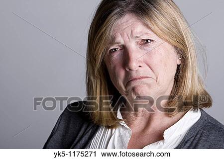 Powerful Shot of a Sad Looking Senior Lady View Large Photo Image Stock Image - Powerful Shot of a Sad Looking Senior Lady. Fotosearch
