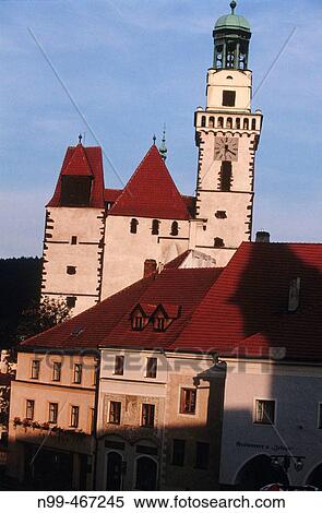 Stock Photography - Prachatice medieval centre with houses from rich citizens at the market place and church. Bohemia. Czech Republic.. Fotosearch