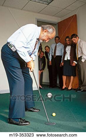 practicing golf in the office View Large Photo Image Stock Image - practicing golf in the office. Fotosearch