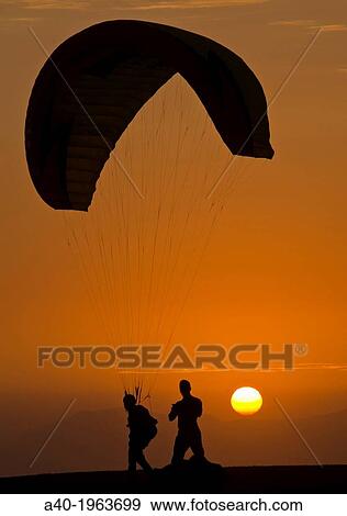 Practicing paragliding on the waterfront of Miraflores district. Lima city. Peru. View Large Photo Image Stock Photo - Practicing paragliding on the waterfront of Miraflores district. Lima city. Peru.. Fotosearch