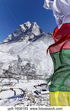 Stock Image - Prayer flags and mountains, Everest Region, Nepal. Fotosearch