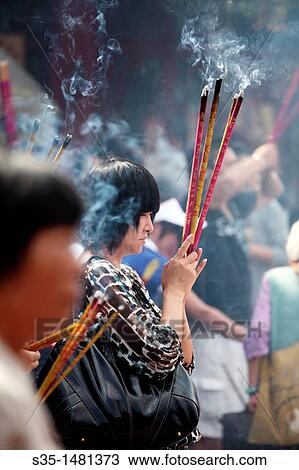 Prayers offer incense to Buddha in Yuantong Temple the famous Buddhist temple build during Tang Dynasty Kunming China. View Large Photo Image Stock Image - Prayers offer incense to Buddha in Yuantong Temple the famous Buddhist temple build during Tang Dynasty Kunming China.. Fotosearch
