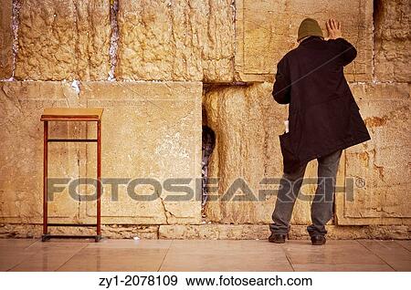 Stock Photo - Praying at the Western Wall (Jerusalem).. Fotosearch