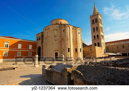 Pre-Romanesque Byzantine St Donat's Church & the campanile bell tower of the St Anastasia Cathedral, Zadar, Croatia View Large Photo Image Picture - Pre-Romanesque Byzantine St Donat's Church & the campanile bell tower of the St Anastasia Cathedral, Zadar, Croatia. Fotosearch