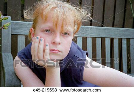 Stock Photo - Pre-teen with blue nail polish. Fotosearch