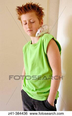 Stock Photograph - Pre-teenager and white rat. Fotosearch