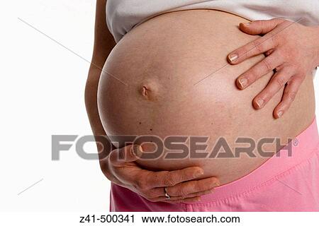 Stock Image - Pregnant belly. Fotosearch