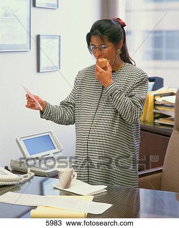 Pregnant Hispanic attorney enjoying a healthy snack at her desk View Large Photo Image Stock Image - Pregnant Hispanic attorney enjoying a healthy snack at her desk. Fotosearch