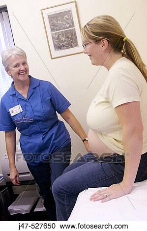 pregnant lady at the doctors having her pre natal checkup View Large Photo Image Stock Image - pregnant lady at the doctors having her pre natal checkup. Fotosearch