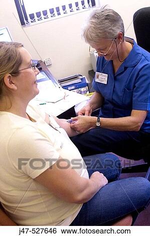 pregnant lady at the doctors having her pre natal checkup, nurse taking blood sample View Large Photo Image Stock Photograph - pregnant lady at the doctors having her pre natal checkup, nurse taking blood sample. Fotosearch