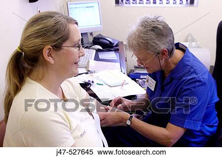 pregnant lady at the doctors having her pre natal checkup, nurse taking blood sample View Large Photo Image Stock Photography - pregnant lady at the doctors having her pre natal checkup, nurse taking blood sample. Fotosearch