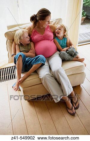 Pregnant mother with two sons. View Large Photo Image Stock Image - Pregnant mother with two sons.. Fotosearch