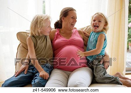 Pregnant mother with two sons. View Large Photo Image Stock Photograph - Pregnant mother with two sons.. Fotosearch