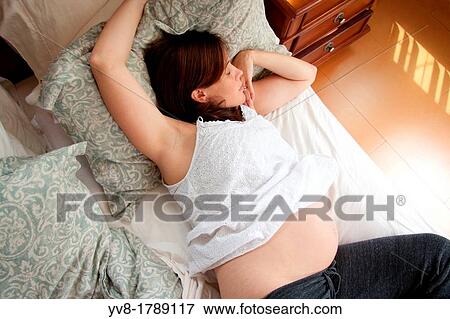 Pregnant resting woman View Large Photo Image Stock Photo - Pregnant resting woman. Fotosearch
