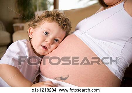 Picture - Pregnant woman and son. Fotosearch