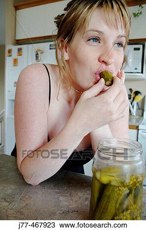 Pregnant woman craving food View Large Photo Image Stock Image - Pregnant woman craving food. Fotosearch
