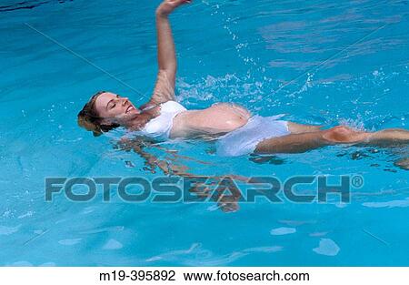 pregnant woman exercising in a swiming pool View Large Photo Image Stock Image - pregnant woman exercising in a swiming pool. Fotosearch