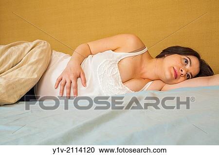 Pregnant woman in bed. View Large Photo Image Stock Image - Pregnant woman in bed.. Fotosearch