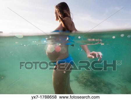 Stock Photo - Pregnant woman in the sea.. Fotosearch